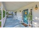 Relaxing front porch with a swing and a white rocking chair at 106 Cicero Ct, Goose Creek, SC 29445