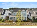 Charming two-story home with inviting front porch and well-manicured front lawn at 113 Jackson Pond Ct, Summerville, SC 29486