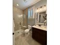 Bathroom featuring tiled walk-in shower, neutral tones, and modern vanity at 114 Magnolia House Dr, Summerville, SC 29486