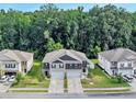 Aerial view of two-story townhomes with well-maintained lawns and mature trees at 116 Bright Meadow Rd, Summerville, SC 29483