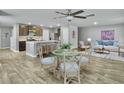 Open-concept living and dining area features wood-look flooring and ceiling fan at 116 Bright Meadow Rd, Summerville, SC 29483