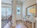 Bright entryway with a stylish console table, mirror, and view into the dining area at 129 Howard Mary Dr # A, Charleston, SC 29412