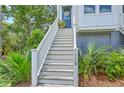 Inviting front porch with well-maintained stairs and lush greenery at 129 Howard Mary Dr # A, Charleston, SC 29412