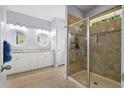 Bathroom with double sink vanity, a glass-enclosed shower and neutral flooring at 1300 Enfield Ln, Mount Pleasant, SC 29466