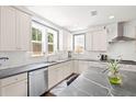 Bright kitchen boasts granite countertops, stainless steel appliances, and ample cabinet space at 1300 Enfield Ln, Mount Pleasant, SC 29466