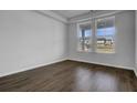 A bright room with natural light, hardwood floors, and neutral walls at 1816 Nola Run, Summerville, SC 29485