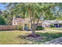 Exterior view of the home with a tree in the yard and a light blue front door at 2076 Presidio Dr, Mount Pleasant, SC 29466