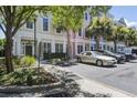 Attractive townhome exteriors with palm trees, sidewalks, and ample parking, set against a backdrop of lush greenery at 656 Coleman Blvd # 402, Mount Pleasant, SC 29464