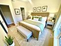 Cozy bedroom with a large bed, soft lighting, and a view, creating a relaxing retreat at 700 Daniel Ellis Dr # 2203, Charleston, SC 29412