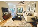 Bright and stylish living room with modern decor, hardwood floors, and comfortable seating at 700 Daniel Ellis Dr # 2203, Charleston, SC 29412