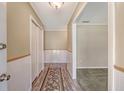 Inviting hallway with wood-look floors, leading to carpeted living spaces at 113 Jackson Rd, Ladson, SC 29456