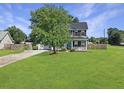 Charming two-story home with a spacious front yard and mature shade tree at 1213 Grasswind Dr, Hanahan, SC 29410
