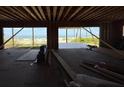 View from inside a house under construction showing the ocean and beach through the windows at 2879 Marshall Blvd, Sullivans Island, SC 29482