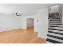 Spacious living area with hardwood floors, white walls, and stairway access at 415 Parkdale Drive # E-8, Charleston, SC 29414