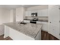 Modern kitchen features stainless steel appliances and a center island with a granite countertop at 5005 Ferry Field Dr, Summerville, SC 29485