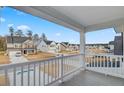 Expansive neighborhood view from a covered outdoor balcony with white railing and gray flooring at 549 Verdi Dr, Summerville, SC 29486