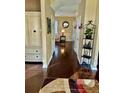 Inviting hallway showcasing hardwood floors and decorative accents, leading to a cozy living space at 620 Saint Ives Ln, Goose Creek, SC 29445