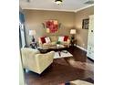 Comfortable living room with stylish decor, hardwood floors, and ample natural light at 620 Saint Ives Ln, Goose Creek, SC 29445
