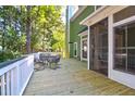 Spacious deck features a dining table and chairs with a view of the backyard at 794 Hunt Club Run, Charleston, SC 29414
