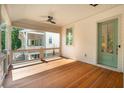 Enjoy the fresh air on this covered porch featuring wood floors, and stylish railings at 9017 Stern Aly, Johns Island, SC 29455