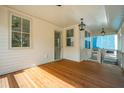 Relax on the porch with wood floors and views, perfect for enjoying the outdoors at 9017 Stern Aly, Johns Island, SC 29455