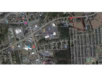 Aerial view showing a large lot near residential homes and businesses at 1501 Central Ave, Summerville, SC 29483