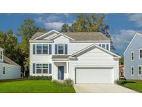 Two-story white house with blue shutters, two-car garage, and landscaped lawn at 132 Morning View Way, Moncks Corner, SC 29461