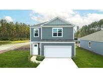 Charming two-story home with a two-car garage and well-maintained landscaping at 5568 Bowmore Blvd, Ravenel, SC 29470