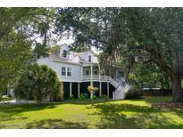 Two-story house with wraparound porch, surrounded by lush landscaping at 3663 Pandora Dr, Mount Pleasant, SC 29466