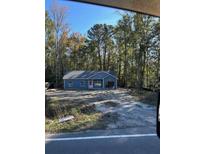 Newly constructed home with gray siding and pink accents at 6209 Drayton St, Ravenel, SC 29470