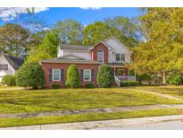 Brick two-story house with a landscaped lawn and walkway at 203 Bamert St, Summerville, SC 29483