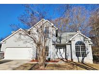 Two-story house with gray siding, attached garage, and manicured lawn at 102 Barrie Ct, Goose Creek, SC 29445
