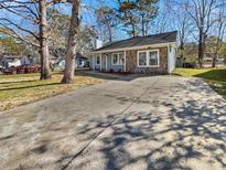 Cute ranch home with stone accents and a large driveway at 110 Manchester Rd, Summerville, SC 29486