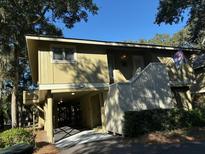 Lowcountry cottage with private driveway and screened porch at 1116 Summerwind Ln, Seabrook Island, SC 29455