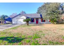Cute ranch home with red shutters, attached garage, and a spacious yard at 1633 Lauda Dr, Mount Pleasant, SC 29464