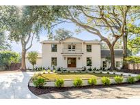 Two-story white brick home with a large front yard and mature trees at 19 Ponce De Leon Ave, Charleston, SC 29407