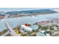Aerial view showing building location near waterway and bridge at 2395 Folly Road Rd # 4F, Folly Beach, SC 29439