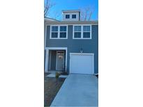 Two-story house with gray siding, attached garage, and landscaping at 493 Trotters Ln # 116, Moncks Corner, SC 29461