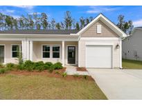 Craftsman style home with attached garage and manicured landscaping at 962 Dusk Dr, Summerville, SC 29486