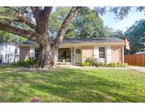 Brick ranch house with mature oak tree and well-manicured lawn at 1162 South Shadow Dr, Mount Pleasant, SC 29464