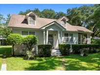 Charming 1-story house with a well-manicured lawn and mature trees at 2028 Coker Ave, Charleston, SC 29412