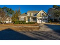 Two-story house with stone accents and a two-car garage at 101 Ribbon Rd, Summerville, SC 29483