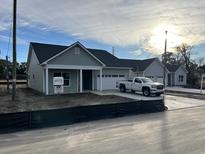 Newly constructed homes with gray siding and attached garages at 3009 Harvey Ave, North Charleston, SC 29405