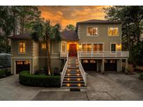 Stunning two-story home with a large driveway and landscaped yard at 6124 Rudder Ln, Awendaw, SC 29429