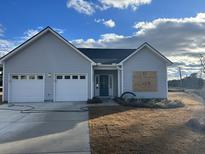 Newly constructed home with gray siding, two-car garage, and landscaped yard at 3005 Harvey Ave, North Charleston, SC 29405