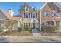 Inviting townhome with charming front porch and landscaping at 503 Reserve Way, Summerville, SC 29485