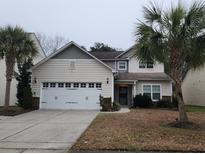 Two-story house featuring a neutral color scheme and a two-car garage at 1708 Indaba Way, Charleston, SC 29414
