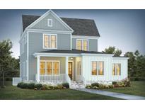 Two-story farmhouse with gray siding, white trim, and a welcoming front porch at 2038 Ironstone Aly # 17, Charleston, SC 29407