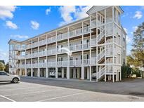 Three-story building with multiple balconies and parking at 2262 Folly Rd # 2-K, Charleston, SC 29412