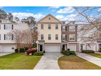 Two story townhome with a brick facade and attached garage at 248 Fair Sailing Rd # 38, Mount Pleasant, SC 29466